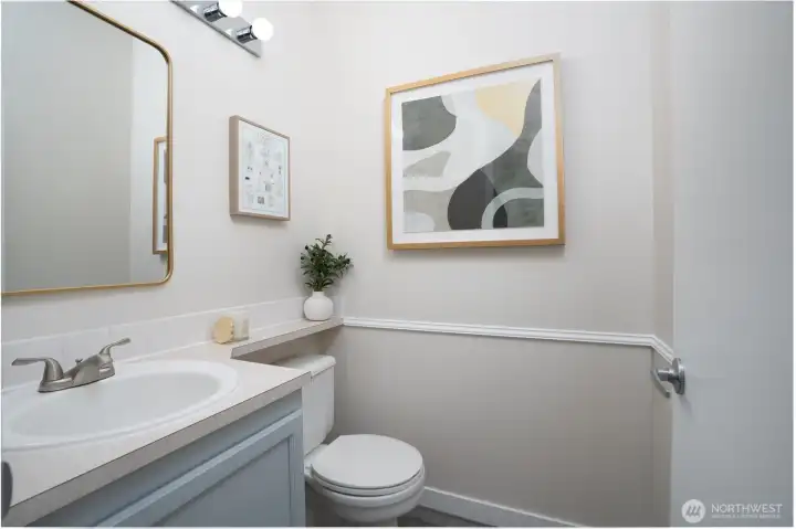 A conveniently located half bath on the main floor ensures guests don’t need to head upstairs.