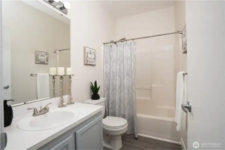 A full bathroom upstairs serves the second bedroom, providing comfort and convenience for guests or additional household use.