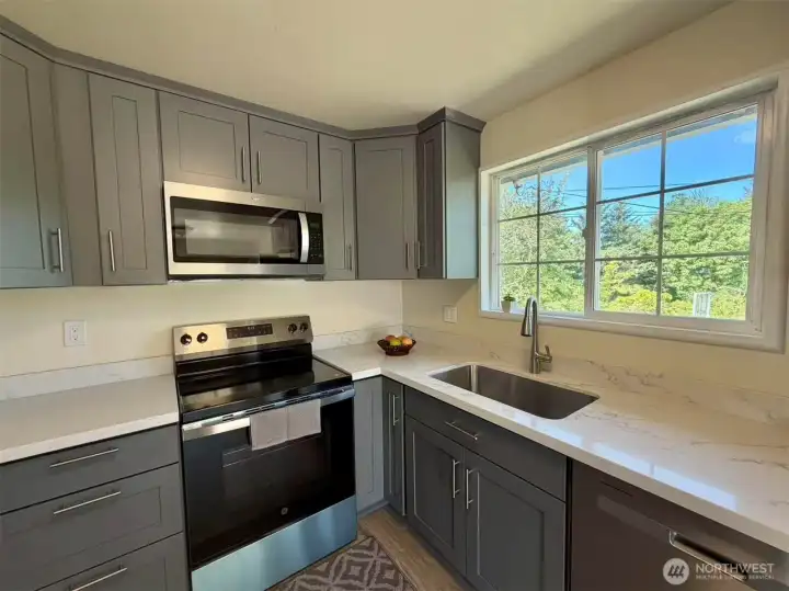 Kitchen with new countertops, cabinets, and appliances
