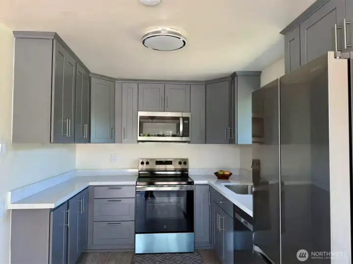 Kitchen with new countertops, cabinets, and appliances