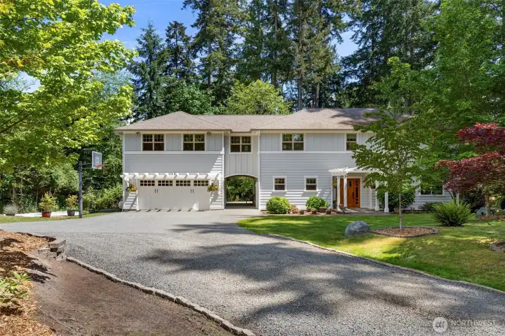 Privately set on Rose Ave, this timeless custome home offers serene Bainbridge Island living.