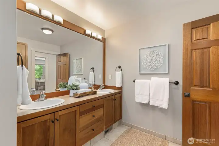 Full bathroom with well-designed storage.
