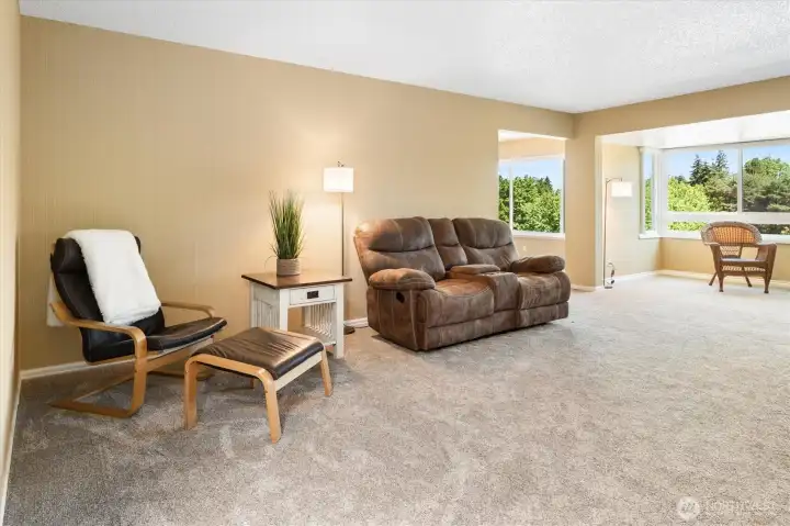Huge living room with a peekaboo view of the bonus room.