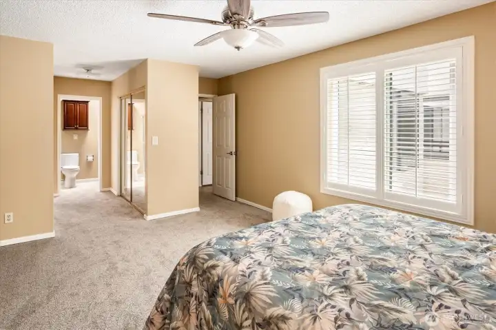 Additional view of the primary bedroom with sightlines to the ensuite.
