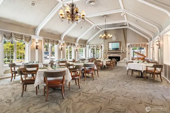 View of the clubhouse fireplace room, which can be used for dining and private events.