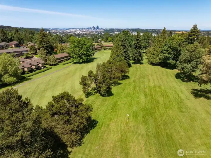 Drone view of the fairway, portions of the complex, and downtown Seattle.