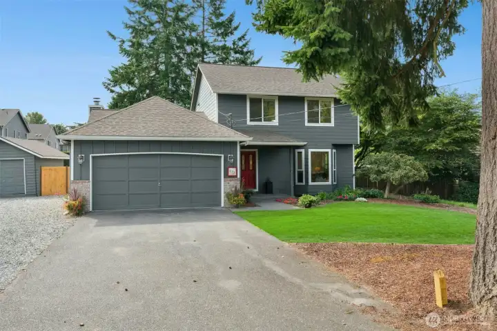 This 1,864 square foot residence combines comfortable living with versatile spaces for entertaining and everyday life.