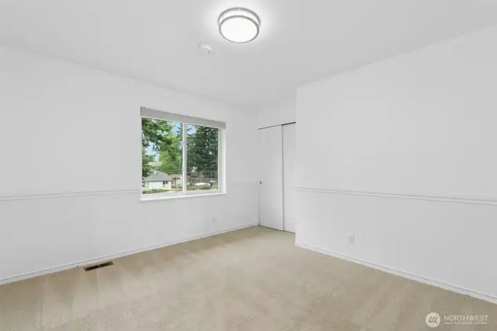 Two additional bedrooms provide flexibility for family, guests, or home office space.