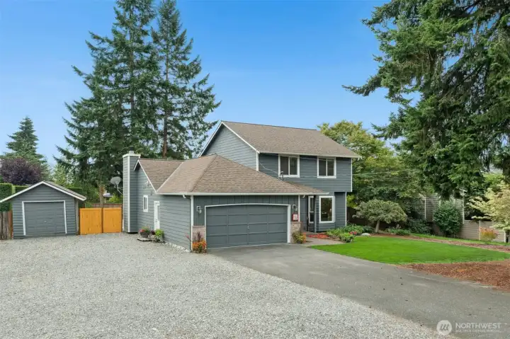 . The home also offers a 2-car attached garage, ample driveway parking, storage shed and RV parking.