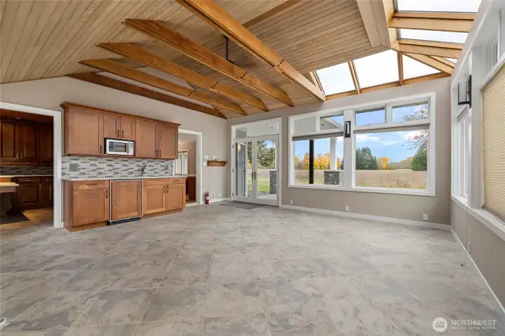 Beautiful atrium with wet bar and entrance into office and/or media room.