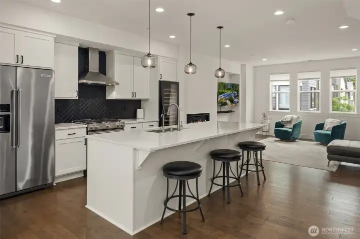 The masterfully designed high end kitchen with full size wine/beverage refrigerator and designer Italian blown glass lighting creating an elegant living space. The masterfully designed high end kitchen with full size wine/beverage refrigerator and designer Italian blown glass lighting creating an elegant living space.