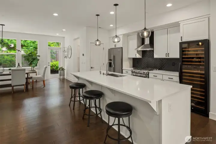 The open concept floorpan makes entertaining a dream with a gas stove, massive quartz island. Easy flow to the dining area keeps you center stage. The open concept floorpan makes entertaining a dream with a gas stove, massive quartz island. Easy flow to the dining area keeps you center stage.