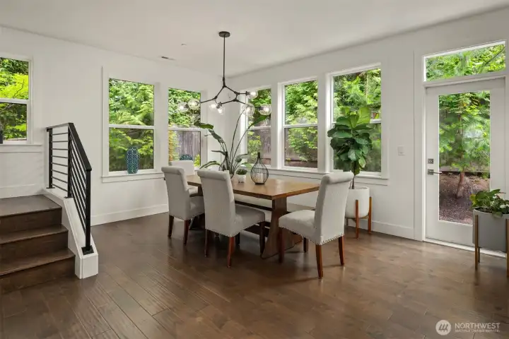 Walls of windows provide natural light as well as bringing nature in. Home boosts custom lighting as well engineered hardwood floors throughout the main floor. Walls of windows provide natural light as well as bringing nature in. Home boosts custom lighting as well engineered hardwood floors throughout the main floor.