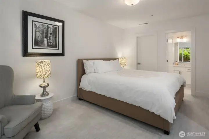 The large en-suite guest bedroom is tucked away downstairs all on it's own for the ultimate privacy. The large en-suite guest bedroom is tucked away downstairs all on it's own for the ultimate privacy.