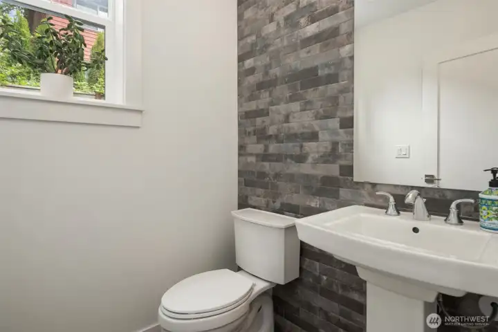 Powder room with custom tile full height wall design. Powder room with custom tile full height wall design.