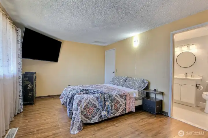 Spacious primary suite with private bathroom access.
