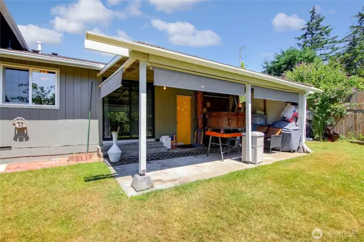 Covered patio off the back of the home, ready for entertaining.