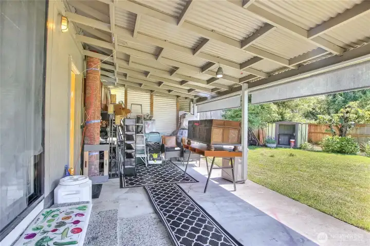 Spacious covered patio opening directly to the backyard.