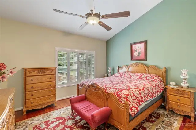 Spacious primary suite with new ceiling fan and light.