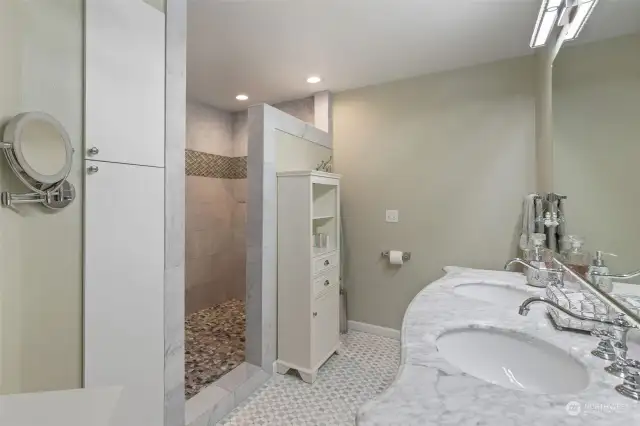 Primary suite bathroom completely remodeled.  Bathtub has been removed and a large shower installed with marble surround.  Marble floors on bathroom floor, new vanity, new linen closet, new light fixtures.  Stunning!