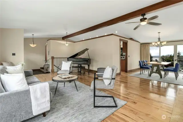 High vaulted ceilings, gleaming hardwood floors in the is grand piano sized living room