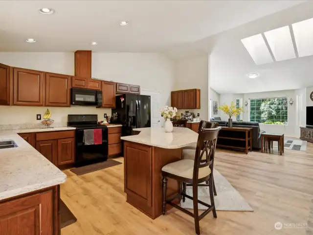 Warm toned LVP flooring through out the whole house.