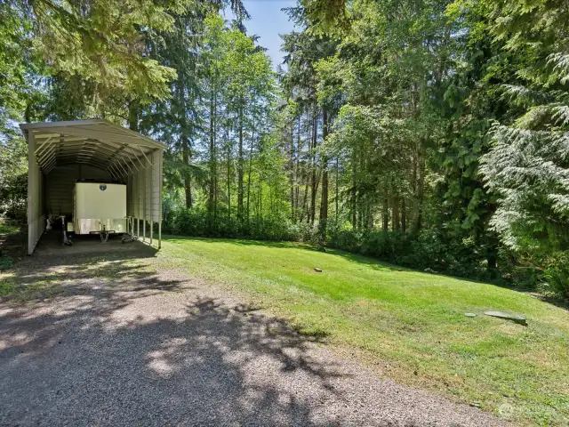 Side yard and covered RV storage/parking.