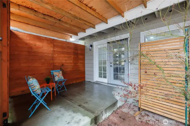 Covered outdoor space off of dining area. Perfect for working from home in the summer!