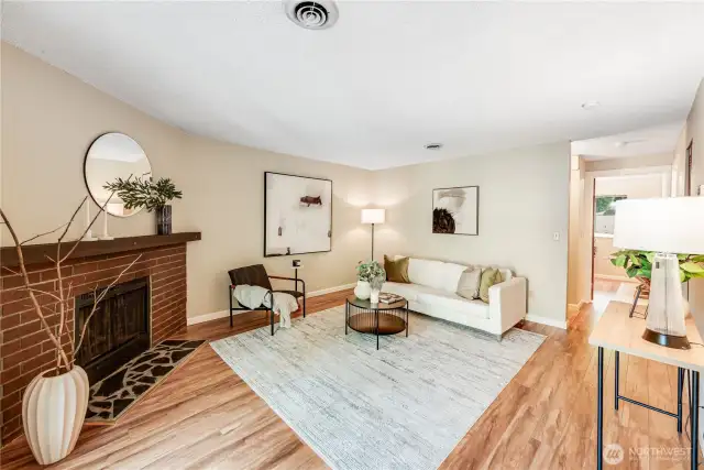 Very open and spacious living room features gorgeous laminate hardwood flooring.