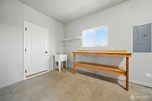 Garage work/hobby area with utility sink