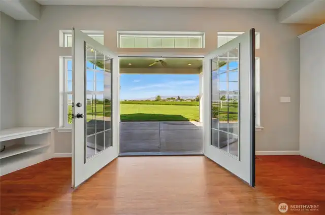 French doors open to covered patio