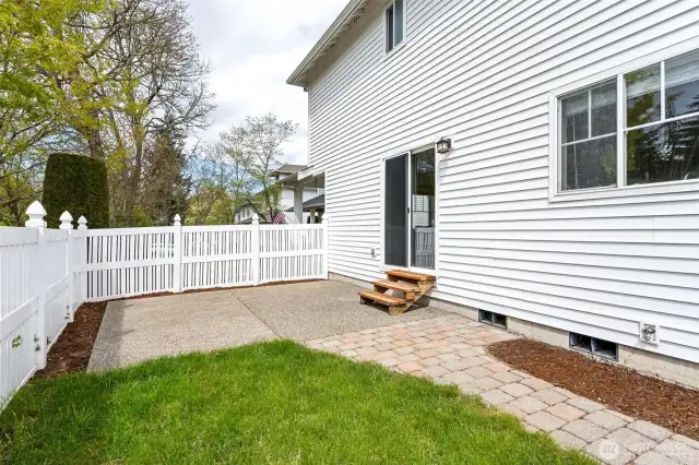 Backyard with extended patio and yard.