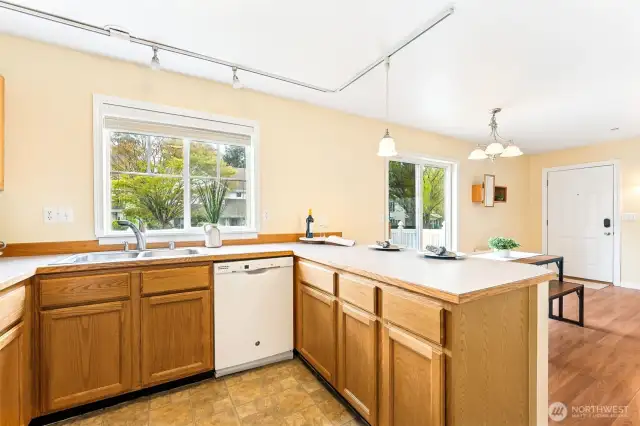 Kitchen also looks out to the back yard and neighborhood.