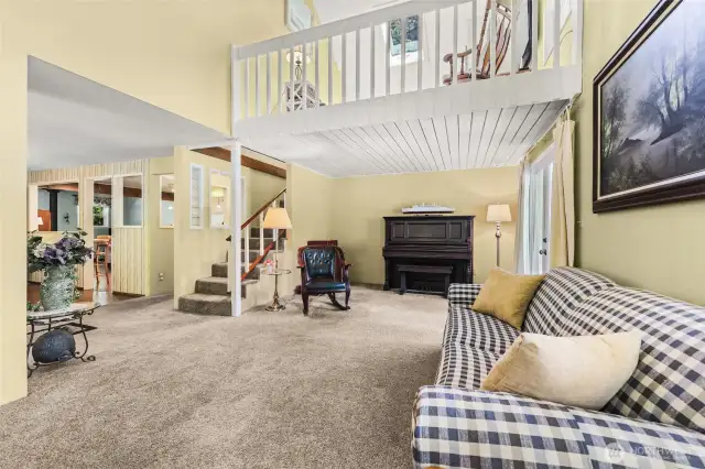 Living room with stair case to 2nd floor .