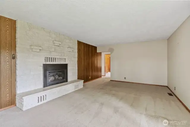 Main floor living room with propane fireplace