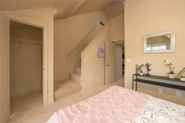 Walk-in closet and stairs to the loft space.