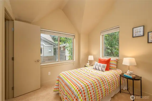 Second bedroom on the upper floor, with a walk-in closet.