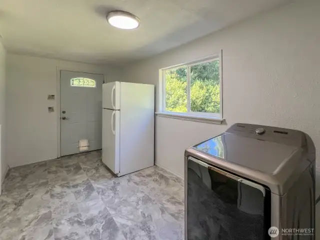 Utility Room with entrance from back patio