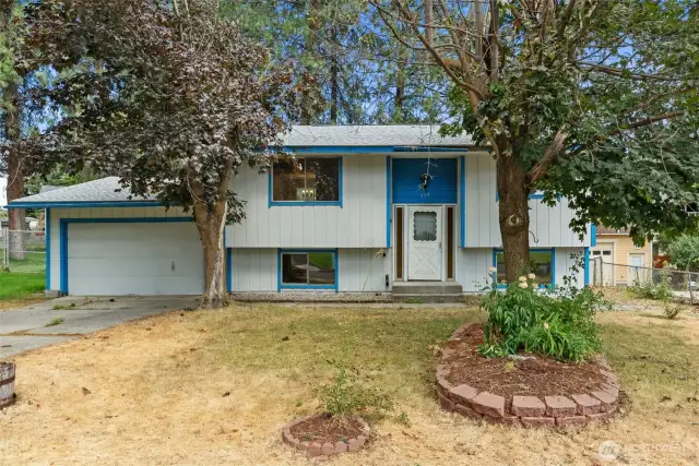 Charming Mid-Century Split-Level- Located in a desirable North Spokane community with established charm.