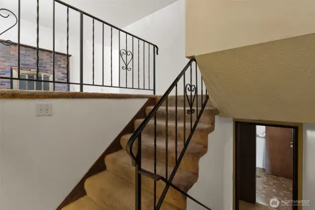 Welcoming entry with access to both upper and lower living areas.