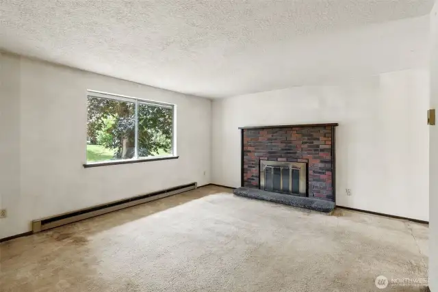 Main living area with large windows and natural light.