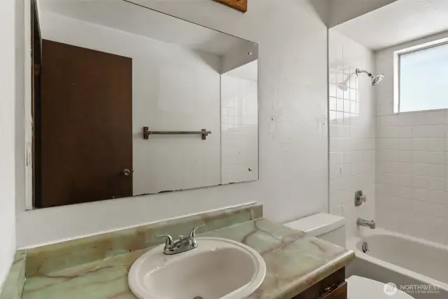 Well-appointed bathroom located close to the bedrooms.