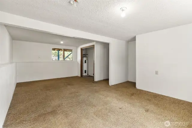 Conveniently Located Water Heater- Tucked away but easily accessible for maintenance.