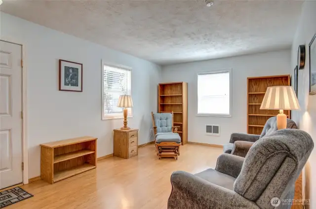 Laminate and vinyl flooring throughout is another plus to this accessible home.