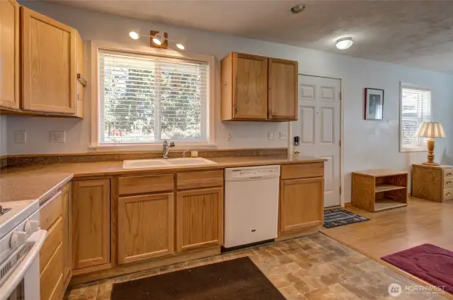 Kitchen window overlooks the front entry and quiet street.