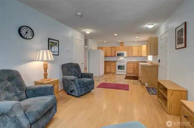 Between the coat closet and refrigerator is the hallway to the rest of the home!