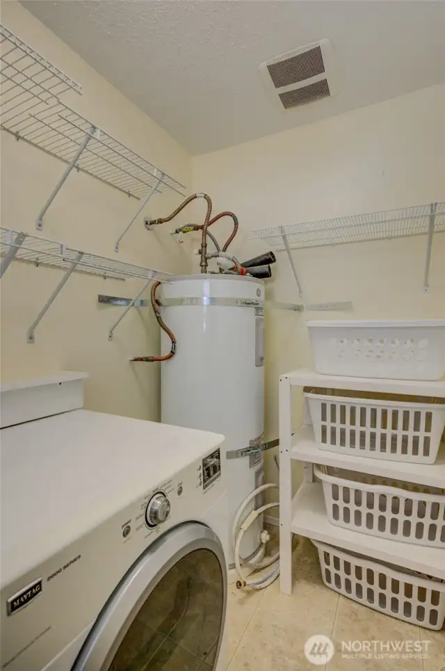 Laundry room has additional storage space, too!