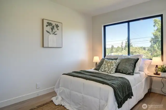 One of two bedrooms on the main floor with continued hardwood floors.
