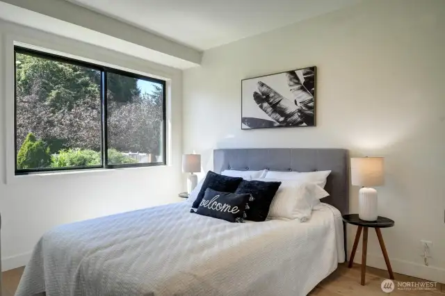 Second bedroom on the main floor has large window for tons of natural light.
