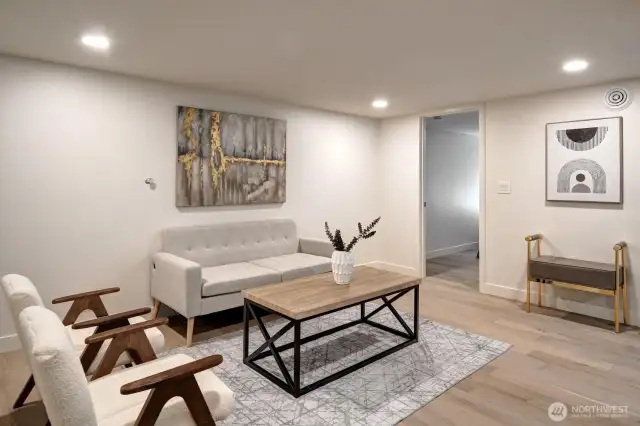 Fully finished lower level offers 2 additional bedrooms, a full bath, and laundry.